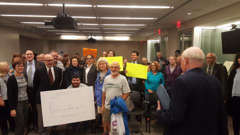 A group who attended the vital records hearing poses for a picture. 